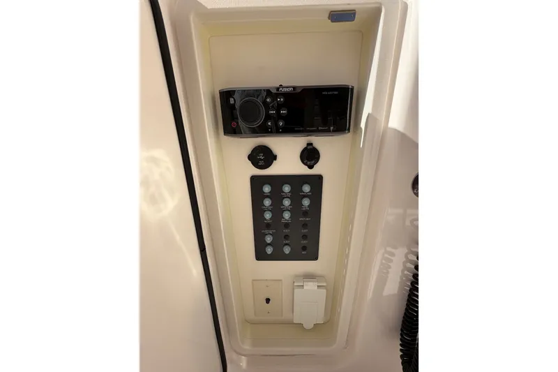 Slide: The Image of Control panel of 2017 Tiara Yachts 39 Convertible with audio system and switches. - 41