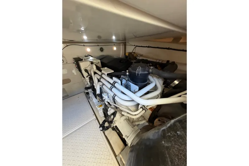 Slide: The Image of Engine room of 2017 Tiara Yachts 39 Convertible, showcasing detailed mechanical components. - 28