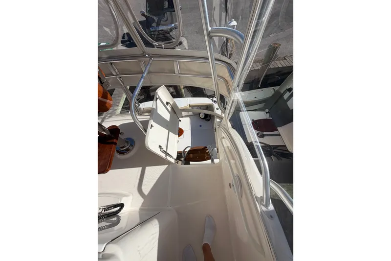Slide: The Image of 2017 Tiara Yachts 39 Convertible boat interior with helm and seating area. - 33