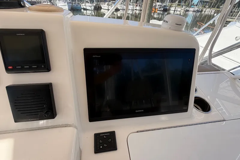 Slide: The Image of Garmin navigation system on 2017 Tiara Yachts 39 Convertible boat dashboard. - 44