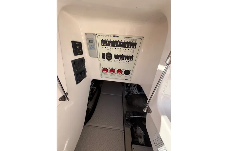 Slide: The Image of Electrical panel inside 2017 Tiara Yachts 39 Convertible boat, showcasing control switches. - 21