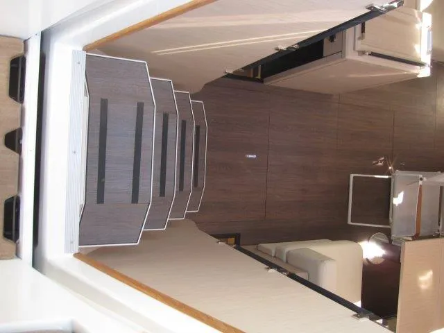 Slide: The Image of Interior stairs of 2025 Jeanneau Yacht 65, leading to modern cabin area. - 47