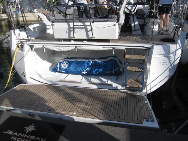 Slide: The Image of Jeanneau Yacht 65 (2025) with open storage compartment and deck view. - 12