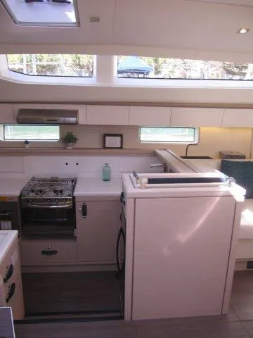 Slide: The Image of Modern kitchen interior of 2025 Jeanneau Yacht 65 with ample natural light. - 49