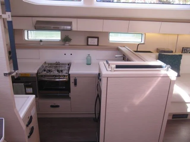 Slide: The Image of Modern kitchen area in 2025 Jeanneau Yacht 65 with stove, oven, and ample storage. - 48