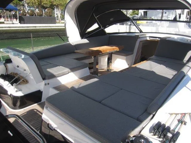 Slide: The Image of 2025 Jeanneau Yacht 65 interior with spacious seating and dining area. - 20