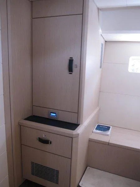 Slide: The Image of Modern interior of 2024 Jeanneau 60 yacht with light wood cabinetry. - 45