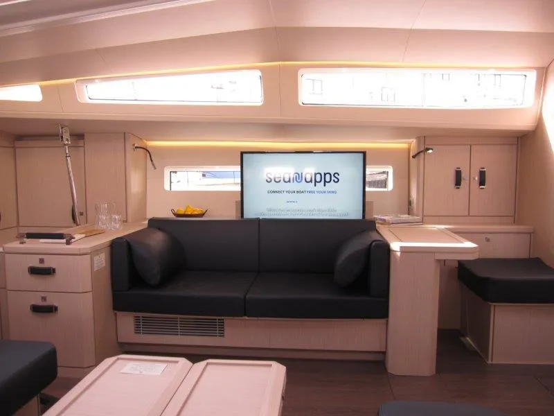 Slide: The Image of Modern interior of 2024 Jeanneau 60 yacht with sleek furnishings and ample natural light. - 6