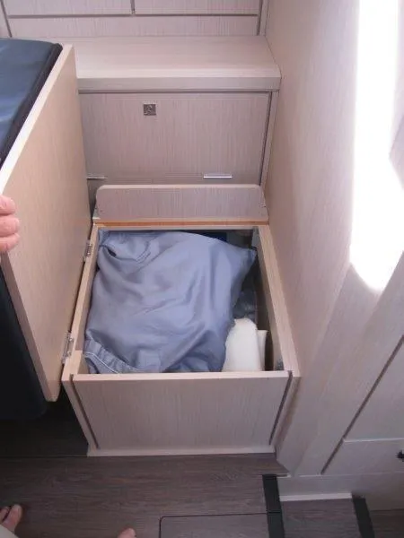 Slide: The Image of Storage compartment in 2024 Jeanneau 60 yacht with bedding inside. - 9