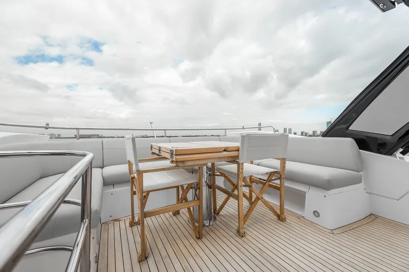 Slide: The Image of Luxurious deck of 2023 Sunseeker Manhattan 55 yacht with seating and table. - 43