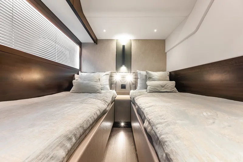 Slide: The Image of Luxurious twin cabin interior of 2023 Sunseeker Manhattan 55 yacht, featuring modern design. - 55