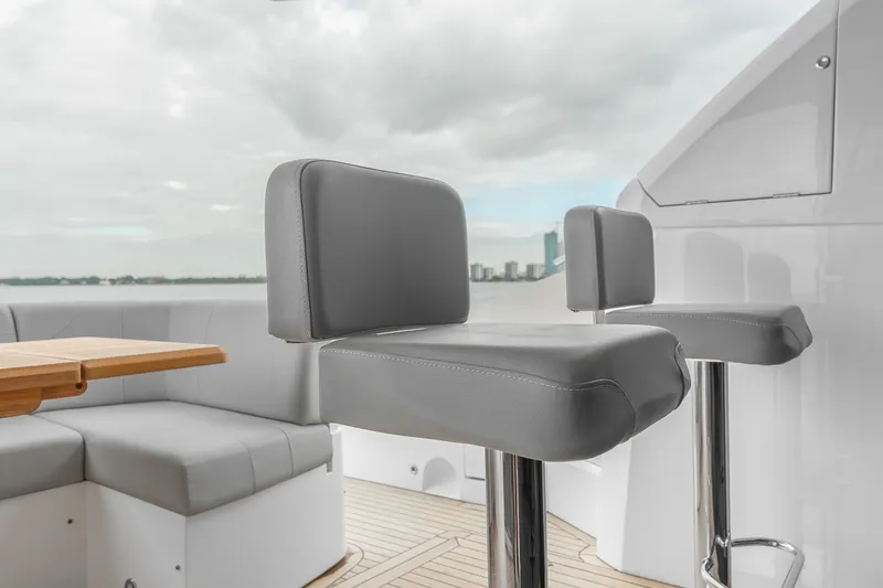 Slide: The Image of Luxury seating on 2023 Sunseeker Manhattan 55 yacht, featuring sleek design and waterfront view. - 36