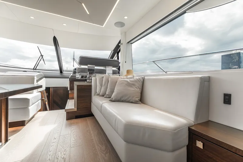 Slide: The Image of Luxurious interior of 2023 Sunseeker Manhattan 55 yacht with modern seating and panoramic windows. - 22