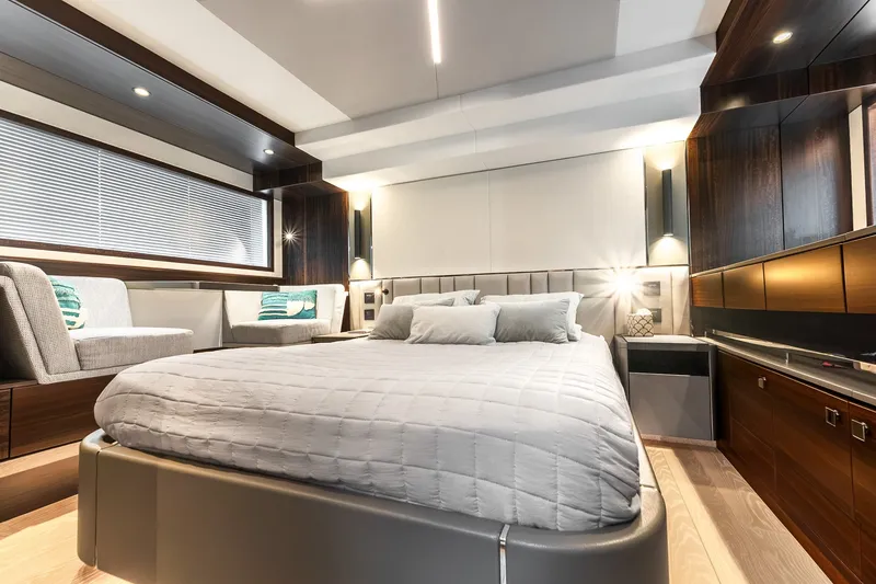 Slide: The Image of Luxurious bedroom interior of 2023 Sunseeker Manhattan 55 yacht, featuring modern design and elegant furnishings. - 56