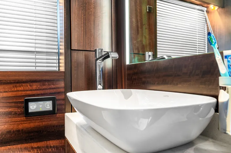 Slide: The Image of Luxury bathroom sink on 2023 Sunseeker Manhattan 55 yacht, featuring modern design and wood accents. - 48