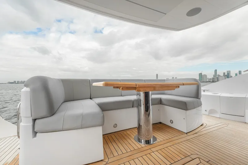 Slide: The Image of Luxurious seating area on 2023 Sunseeker Manhattan 55 yacht with city skyline view. - 35