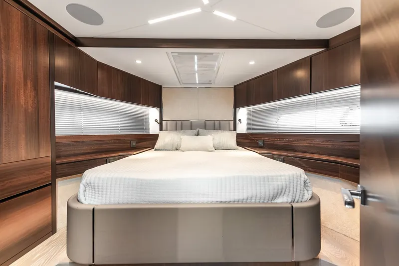 Slide: The Image of Luxurious bedroom interior of 2023 Sunseeker Manhattan 55 yacht with modern wood finishes. - 52
