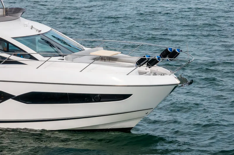 Slide: The Image of 2023 Sunseeker Manhattan 55 yacht cruising on open water. - 6