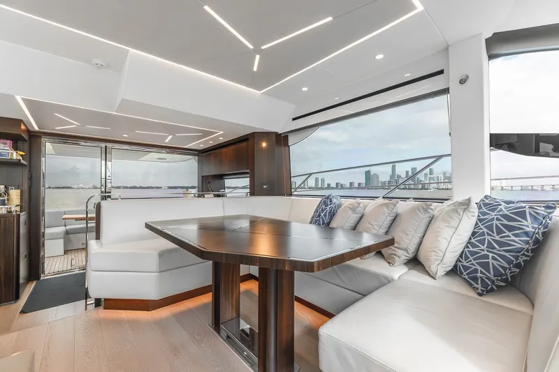 Slide: The Image of Luxurious interior of 2023 Sunseeker Manhattan 55 yacht with elegant seating and city skyline view. - 27