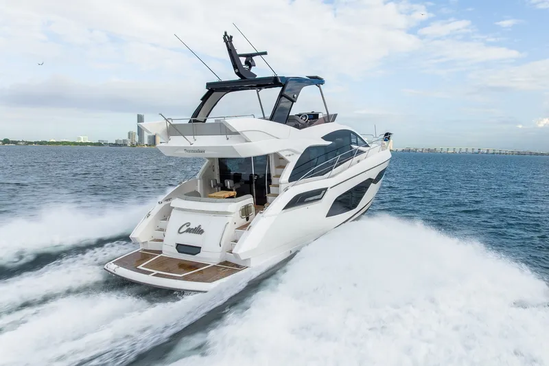 Slide: The Image of 2023 Sunseeker Manhattan 55 yacht cruising on open water, showcasing sleek design and luxury. - 0