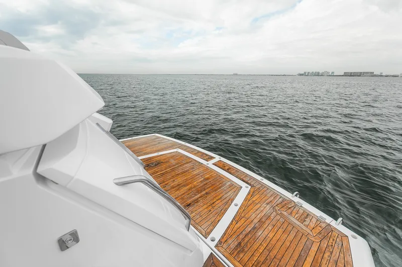 Slide: The Image of Luxury Sunseeker Manhattan 55 yacht deck overlooking the ocean, 2023 model. - 34