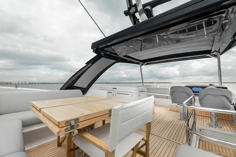 Slide: The Image of Luxurious 2023 Sunseeker Manhattan 55 yacht deck with seating and ocean view. - 44