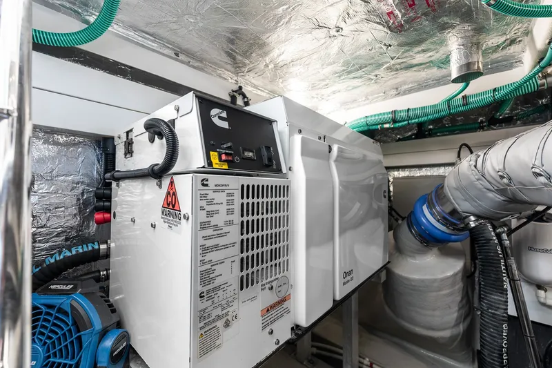 Slide: The Image of Engine room of 2023 Sunseeker Manhattan 55 yacht with Cummins generator. - 60