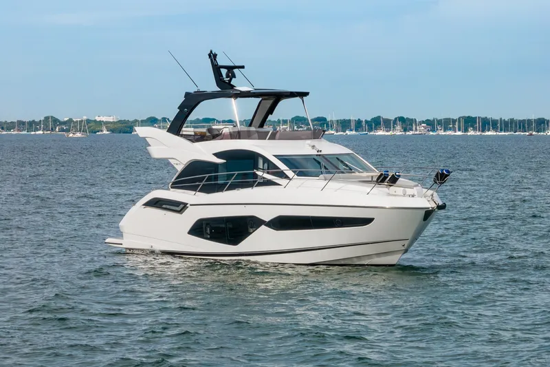 Slide: The Image of 2023 Sunseeker Manhattan 55 yacht cruising on a calm sea. - 8