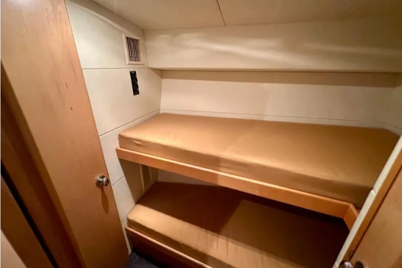 Slide: The Image of Interior of 1985 Bertram 54 Convertible yacht with twin bunk beds. - 20