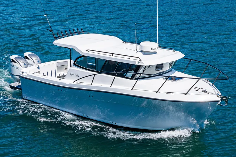 Slide: The Image of 2025 Ocean Sport 27 boat cruising on blue ocean waters. - 34