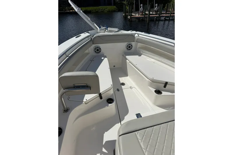 Slide: The Image of 2023 Pursuit S 248 Sport boat interior with seating and cup holders. - 20