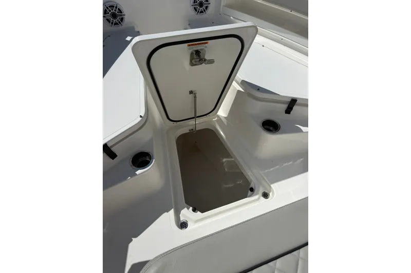 Slide: The Image of Open storage compartment on 2023 Pursuit S 248 Sport boat deck. - 23