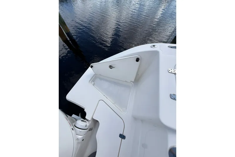 Slide: The Image of 2023 Pursuit S 248 Sport boat deck detail with water reflection. - 8