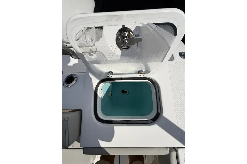 Slide: The Image of Open livewell on 2023 Pursuit S 248 Sport boat, showcasing interior design. - 5