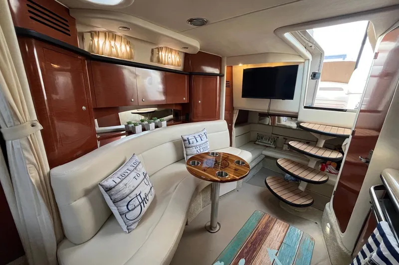 Slide: The Image of Luxurious interior of 2005 Sea Ray Sundancer 320 yacht with elegant seating and modern amenities. - 21