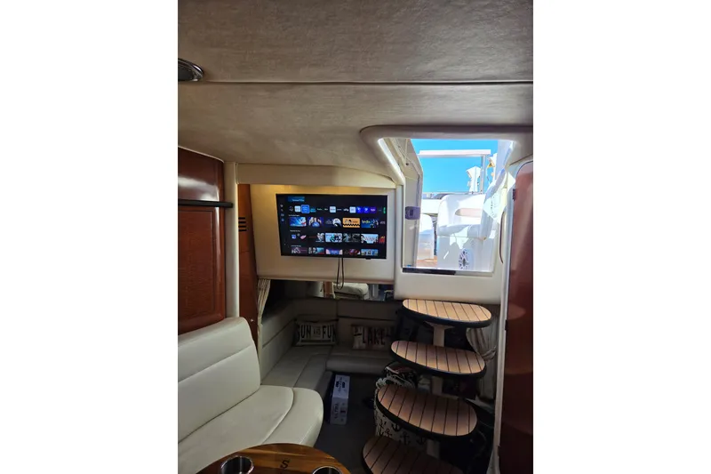 Slide: The Image of Interior of 2005 Sea Ray Sundancer 320 yacht with TV and wooden steps. - 25