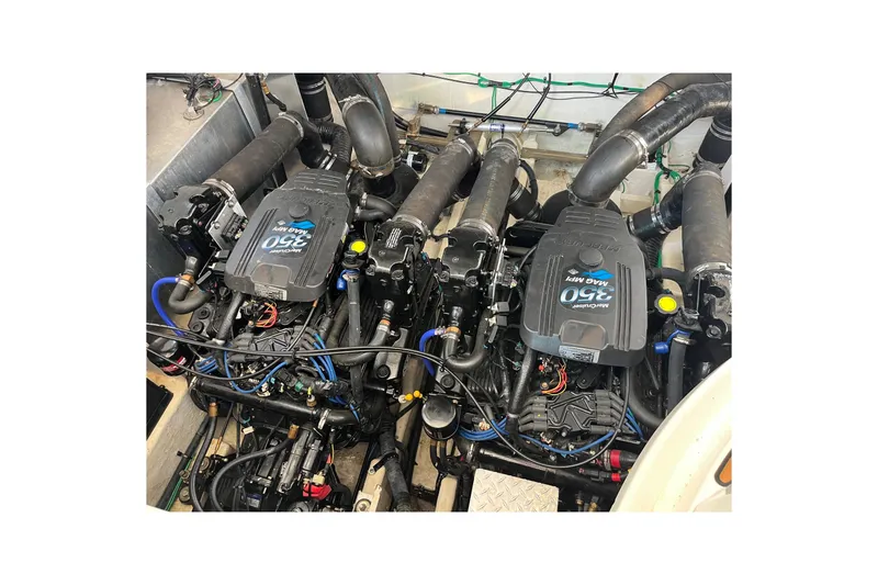 Slide: The Image of Twin engines of a 2005 Sea Ray Sundancer 320 boat, showcasing MerCruiser 350 MAG MPI. - 30