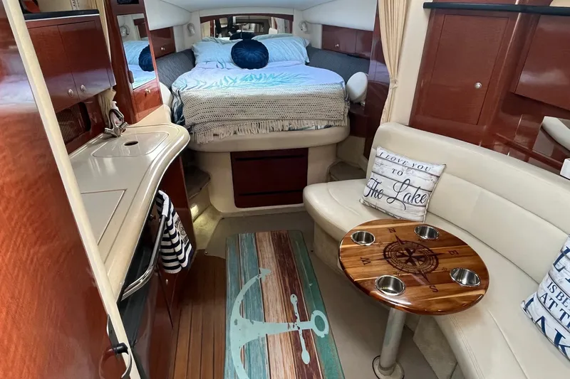 Slide: The Image of Luxurious interior of 2005 Sea Ray Sundancer 320 with cozy bed and stylish seating area. - 20
