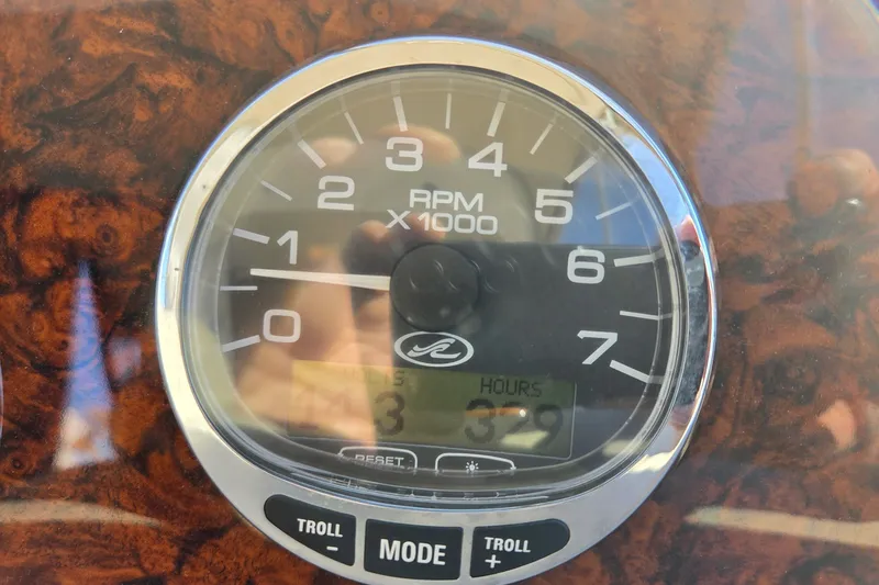 Slide: The Image of Tachometer of 2005 Sea Ray Sundancer 320 displaying RPM and engine hours. - 13