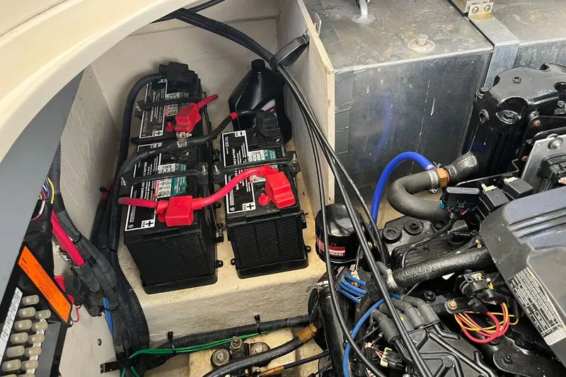 Slide: The Image of Engine compartment of a 2005 Sea Ray Sundancer 320 with batteries and wiring. - 31