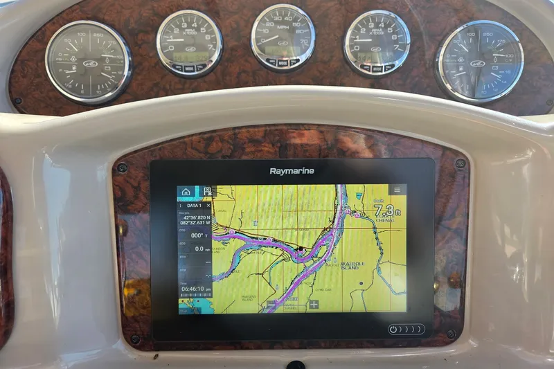 Slide: The Image of Dashboard of a 2005 Sea Ray Sundancer 320 with Raymarine navigation display. - 11