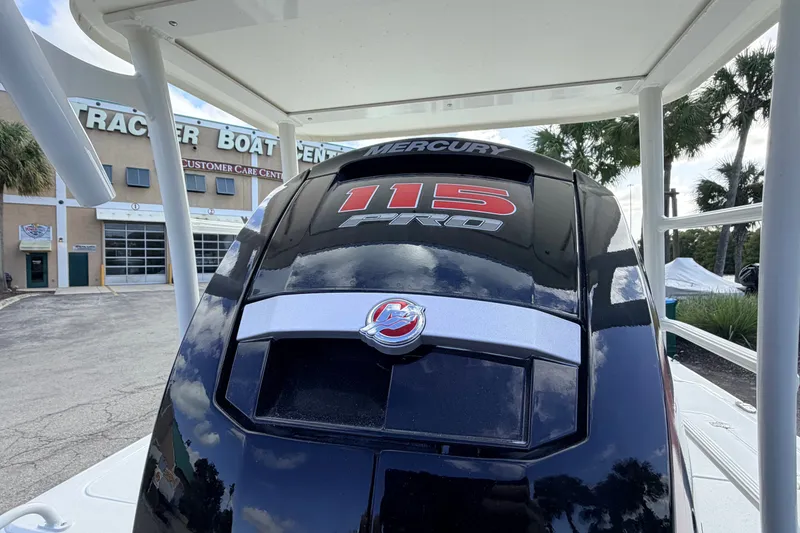 Slide: The Image of 2026 Mako 18 Pro Skiff with Mercury 115 Pro outboard engine at boat center. - 6
