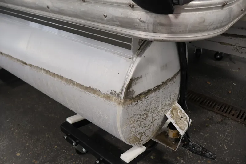 Slide: The Image of 2008 Sun Tracker Fishin' Barge 21 pontoon detail, showing wear and algae growth. - 45