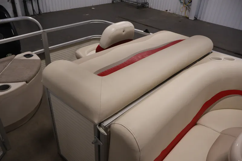 Slide: The Image of 2008 Sun Tracker Fishin' Barge 21 interior with beige and red seating. - 28