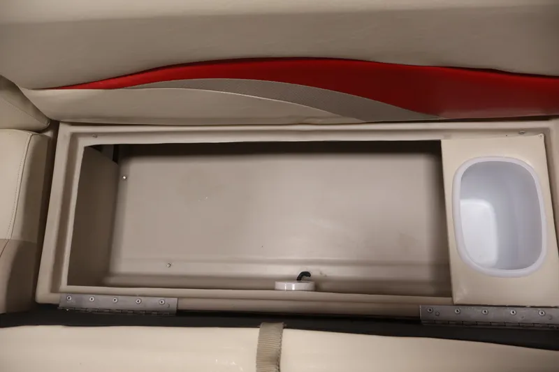 Slide: The Image of Storage compartment in a 2008 Sun Tracker Fishin' Barge 21 boat interior. - 26