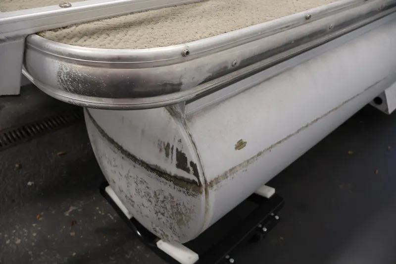 Slide: The Image of 2008 Sun Tracker Fishin' Barge 21 pontoon detail with visible wear and metal trim. - 43