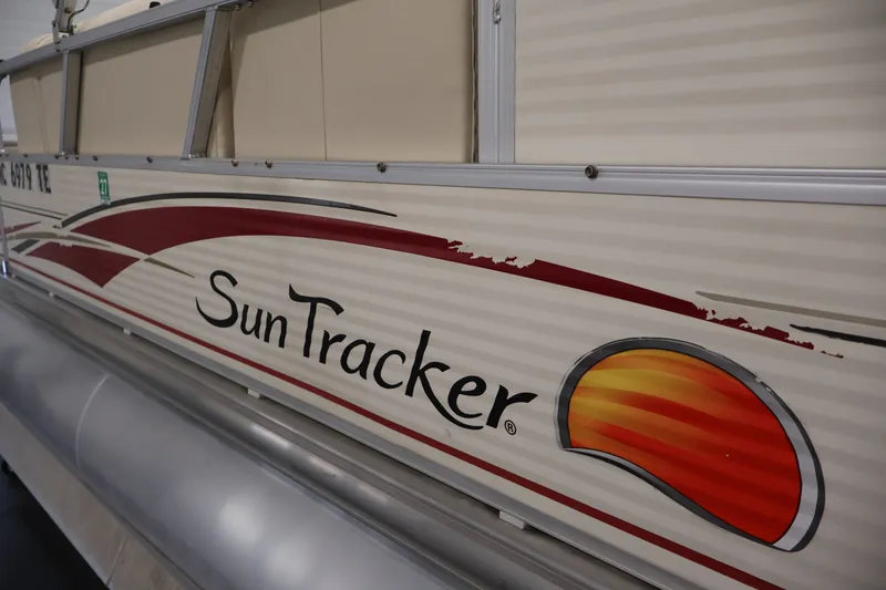 Slide: The Image of 2008 Sun Tracker Fishin' Barge 21 pontoon boat with logo and design details. - 46