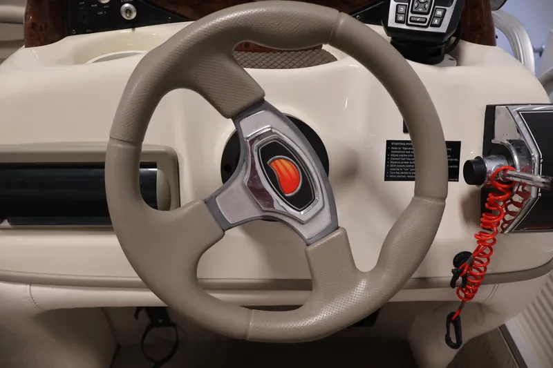 Slide: The Image of Steering wheel of a 2008 Sun Tracker Fishin' Barge 21 boat. - 16