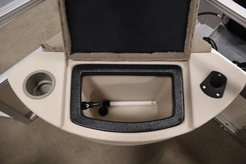 Slide: The Image of 2008 Sun Tracker Fishin' Barge 21 livewell with cup holder and rod holder. - 32