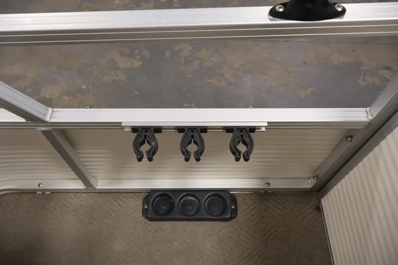 Slide: The Image of 2008 Sun Tracker Fishin' Barge 21 interior with rod holders and cup holders. - 35